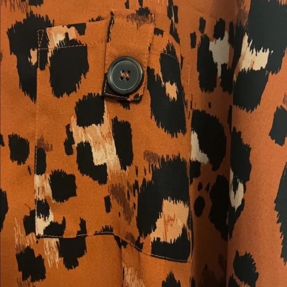 Sexy leopard top with cuffed button sleeves. Throw on and go. - Picture 4 of 4